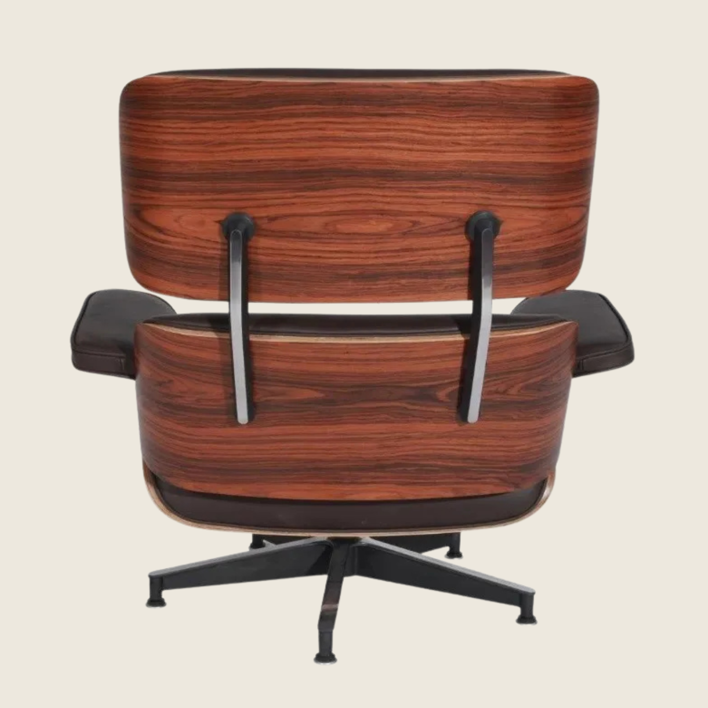 BROWN — Rosewood Lounge Chair & Ottoman, close-up detail of the leather and wood shell