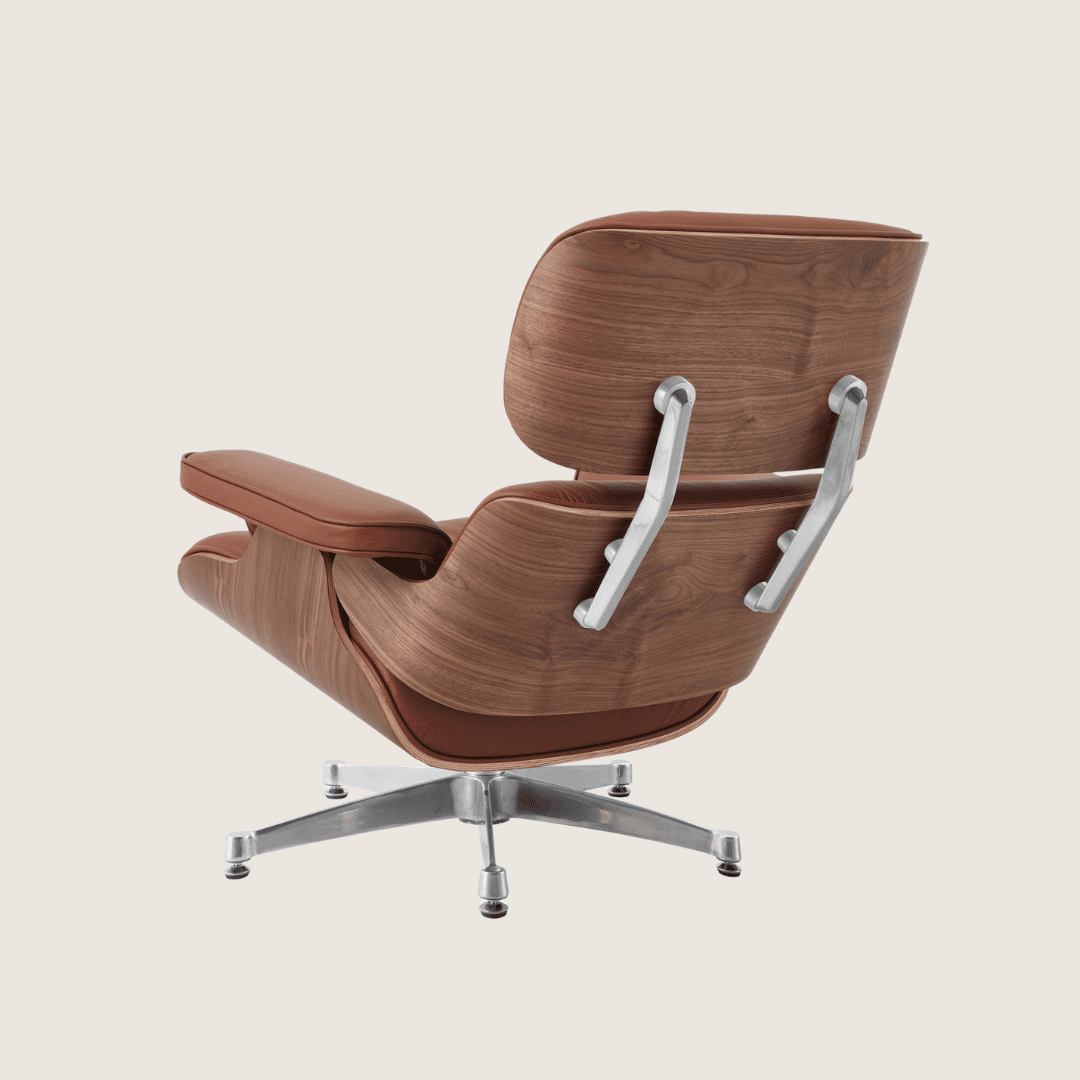 Tan Brown leather, Walnut shell, Chrome base - Eames Style Walnut Lounge Chair & Ottoman, rear three-quarter view showing the walnut veneer shell and polished chrome back braces on the five-star base