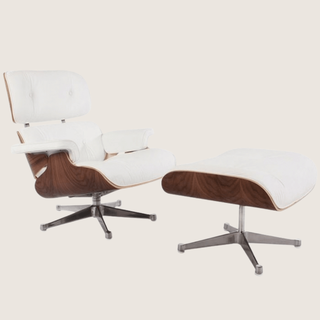 White leather, Walnut shell, Chrome base - Eames Style Walnut Lounge Chair & Ottoman, three-quarter view of the full set with white leather cushions, walnut veneer shell and the matching ottoman on its chrome four-star base